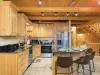 The openness of the kitchen makes it easy to chat with friends or family while cooking, or to catch the glow of the fire and the sound of laughter as you move between the rooms.