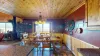 Sliding glass doors are located in the dining area to access the deck.