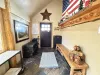 The entryway of the cabin has seating and storage during your stay.