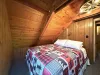 Bedroom #3 located upstairs with a queen size bed.