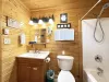 The main bathroom is equipped with a shower tub combo, toilet, and sink vanity.