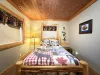 Bedroom #4 located in the basement with a Queen bed.