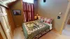 Bedroom #3 located upstairs with a Queen size bed.