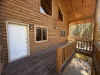 Outside deck with seating to enjoy the beautiful landscape of the cabin.