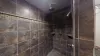 Bathroom on the main floor with a standing walk-in shower.