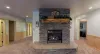 Fireplace in the basement living room to relax after a long day outdoors.