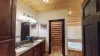This bathroom is equipped with a tub, standing shower, toilet, and double sink vanity.
