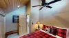 Large open bedroom that brings in lots of natural light.