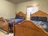 Bedroom #2 located in the basement, equipped with 2 Queen size beds.