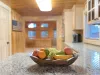 A fruit bowl 0n the counter for those quick to go snacks.