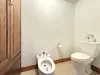 Master ensuite toilet and bidet closet.