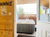 Walk out back to enjoy the hot tub available year round.