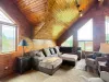 Relax on the plush loft seating surrounded by unique geometric windows that flood the entire upper floor with breathtaking natural light.