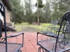 Patio with chairs for you to enjoy around the fire pit.