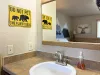 Sink and hand towel is located in this bedroom.