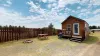 This Tiny house cabin blends rustic charm with modern amenities, nestled within the serene forested landscapes near Yellowstone National Park.