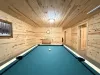 Game room with a Pool table for some friendly competition.