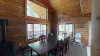 Large dining table that seats 8 with additional seating at the kitchen island.