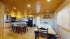 Large dining table and island chairs to seat everyone.