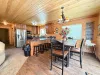 Gather everyone together at the rustic wooden dining table, complete with additional seating at the convenient kitchen breakfast bar stools.