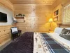 Imagine a cozy cabin bedroom that instantly makes you want to curl up and stay awhile.