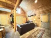 The living room with seating and tv for entertainment.