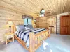 Master bedroom with king size bed on main floor. Fire in the fire pit