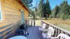 Seating outside to enjoy the beautiful landscape of the cabin.