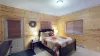 The master bedroom is so cozy with a queen bed and a ensuite bathroom.