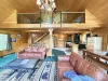 Spacious living room with fireplace for you to enjoy.