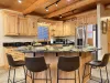 Fully equipped kitchen with appliances, cookware, dishes, utensils, and some basic spices.