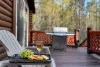 Kitchen porch with seating and a propane grill