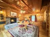 Entrance into the dining area with a dining table and a propane fireplace.