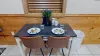 A small but comfortable dining room table to comfortably seat 2 people.