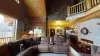 Lots of natural light flows into this room from the large windows.