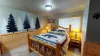 Room is equipped with a queen bed.