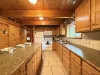 Full size kitchen with appliances, cookware, pots and pans, utensils, dishes, and basic cooking essentials.