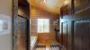 Upstairs shared bathroom on the West Wing with a soaking tub, standing shower, toilet, and sink vanity.