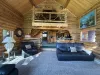 From the living room you can view the upstairs loft, kitchen, and master bedroom.