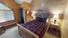 Bedroom #1 located on the upstairs level with a Queen size bed in the room.