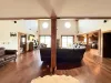Natural light pours in through large windows, tying it all together with a view of the forest just beyond.