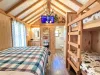 The cozy cabin also has a comfy queen bed to get a good nights rest. A vanity and sink is also available for getting ready for bed or getting ready for your day exploring Yellowstone.