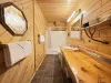 Upstairs bathroom with shower tub combo, toilet, and sink vanity.