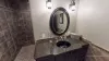 A toilet and sink vanity is also included in the bathroom.