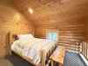 A queen bed is located upstairs in the loft.