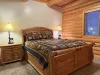 Bedroom #4 located on the main level with a Queen size bed.