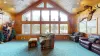 Natural light pours in through large windows, tying it all together with a view of the forest just beyond.
