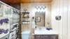 Full bathroom with a shower tub combo, sink vanity, and a toilet.