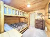 Bedroom #1 with a bunk bed with 2 queen size beds.