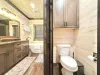 Toilet closet and the deluxe master shared bathroom.
